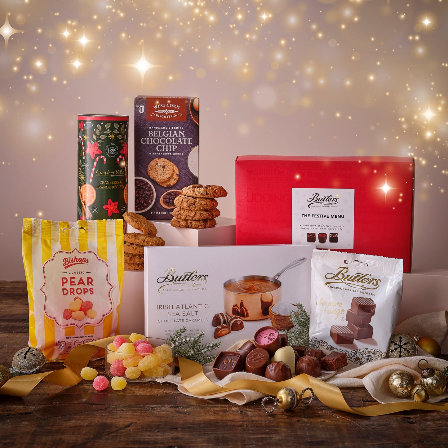 Assorted Butlers confectionery products on a wooden table with a festive background