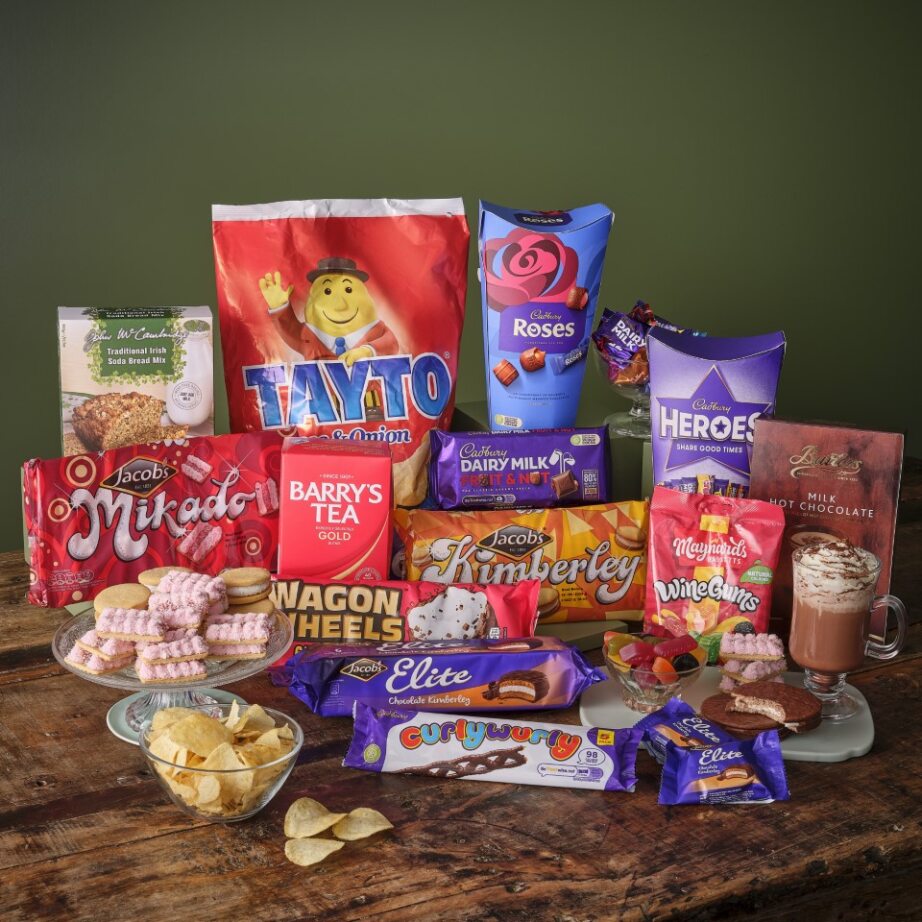 Not Before Your Dinner Hamper filled with Tayto crisps Cadbury Roses chocolates and other snacks.