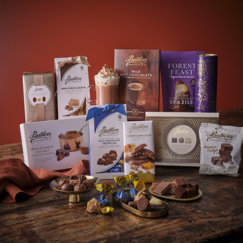 Chocolate Sensations Hamper with assorted chocolate boxes and treats on a rustic wooden table.