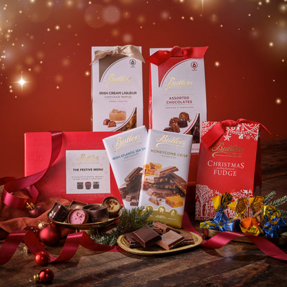Butlers chocolate products including boxes, packets, and fudge on a festive background with red and gold colors.