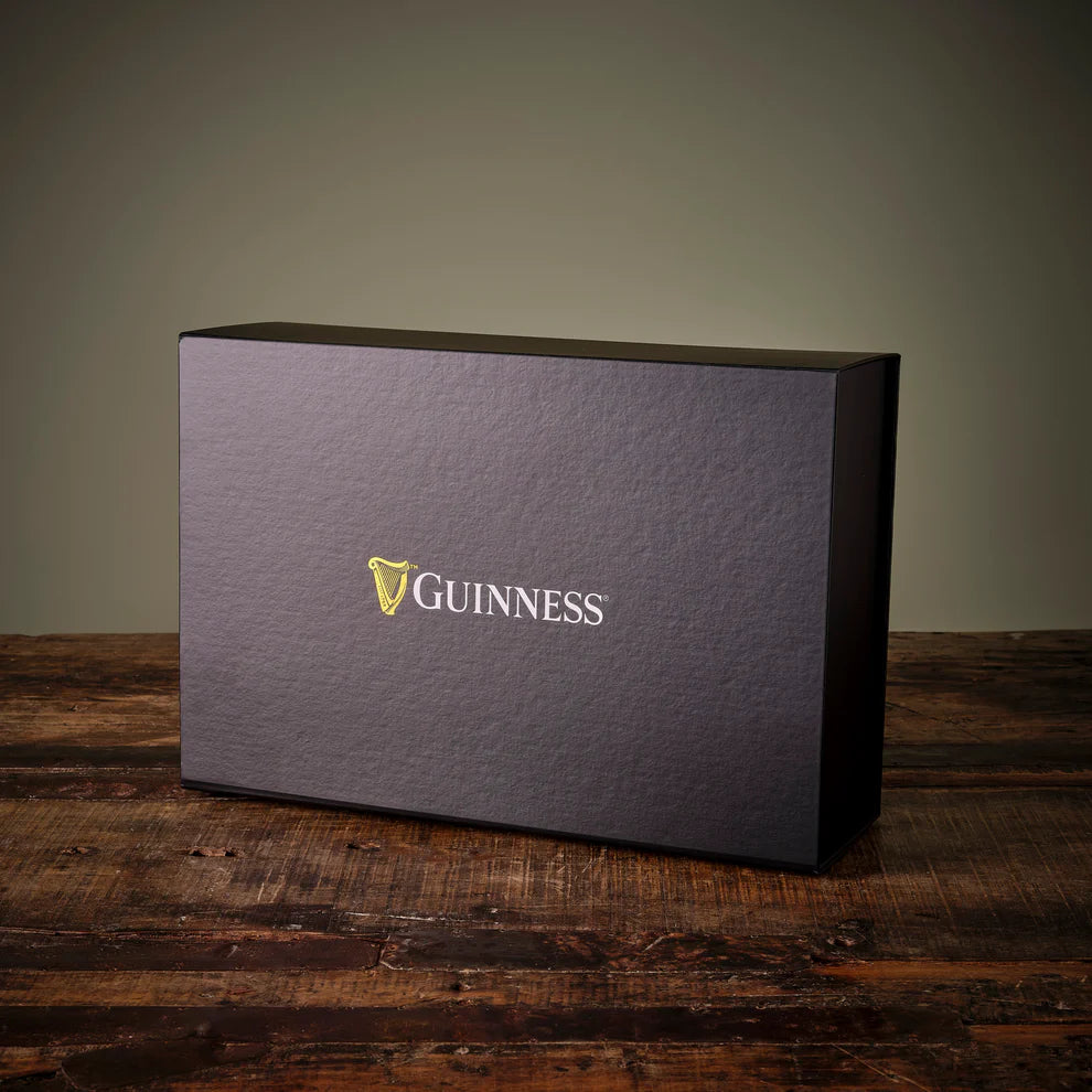Black box with Guinness logo on a wooden surface