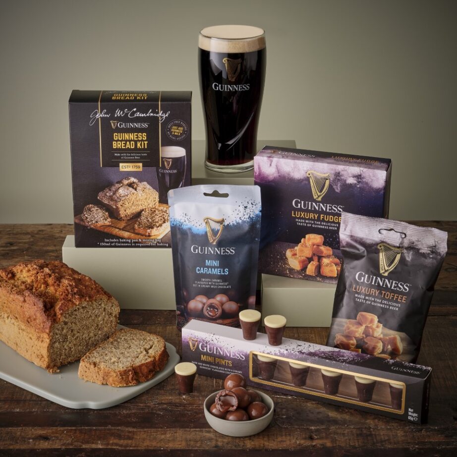 Guinness treats hamper featuring a bread kit, luxury fudge, mini pints and chocolates with a tall Guinness glass.