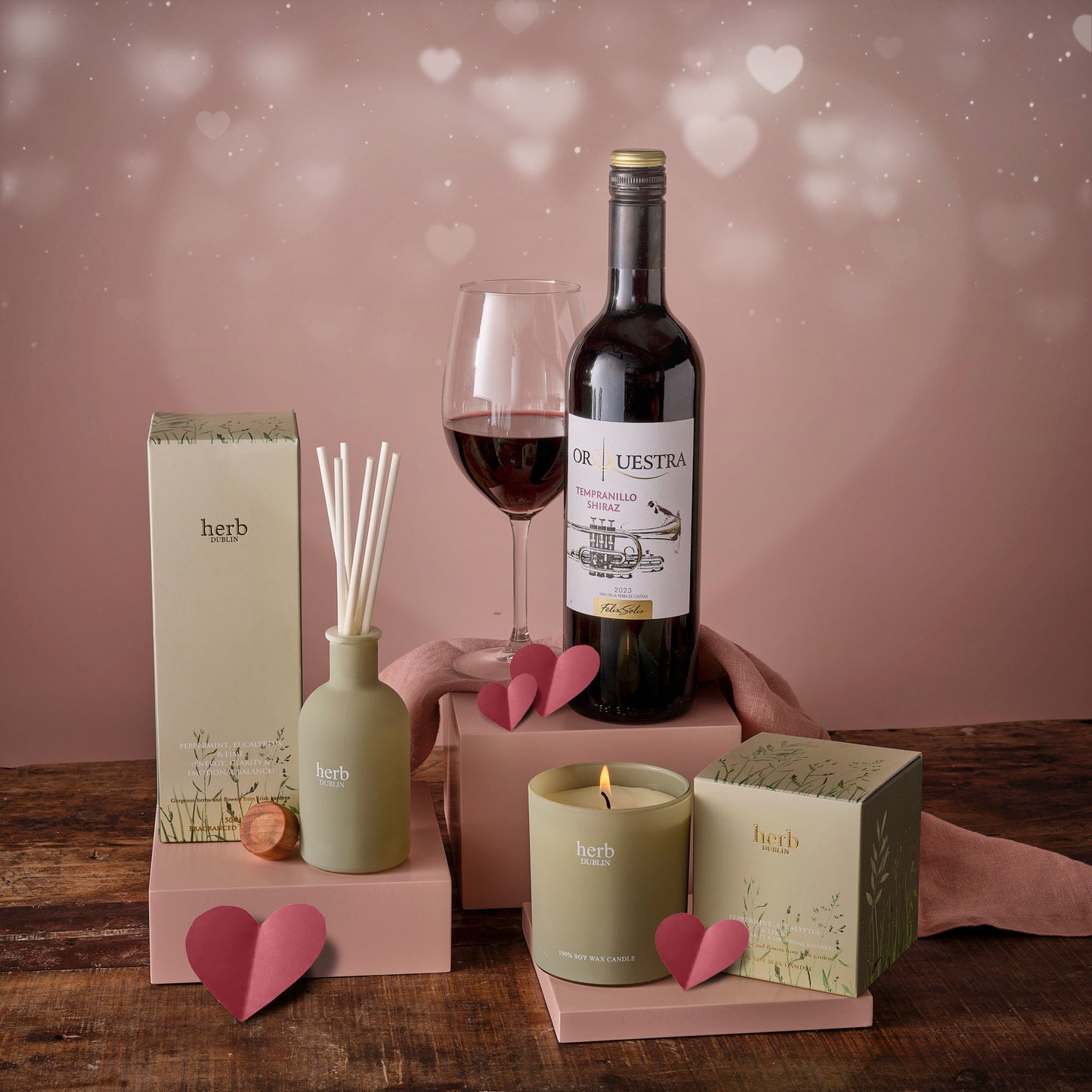 Romantic Relax and Unwind Hamper with wine bottle, glass, candle, diffuser and gift boxes.