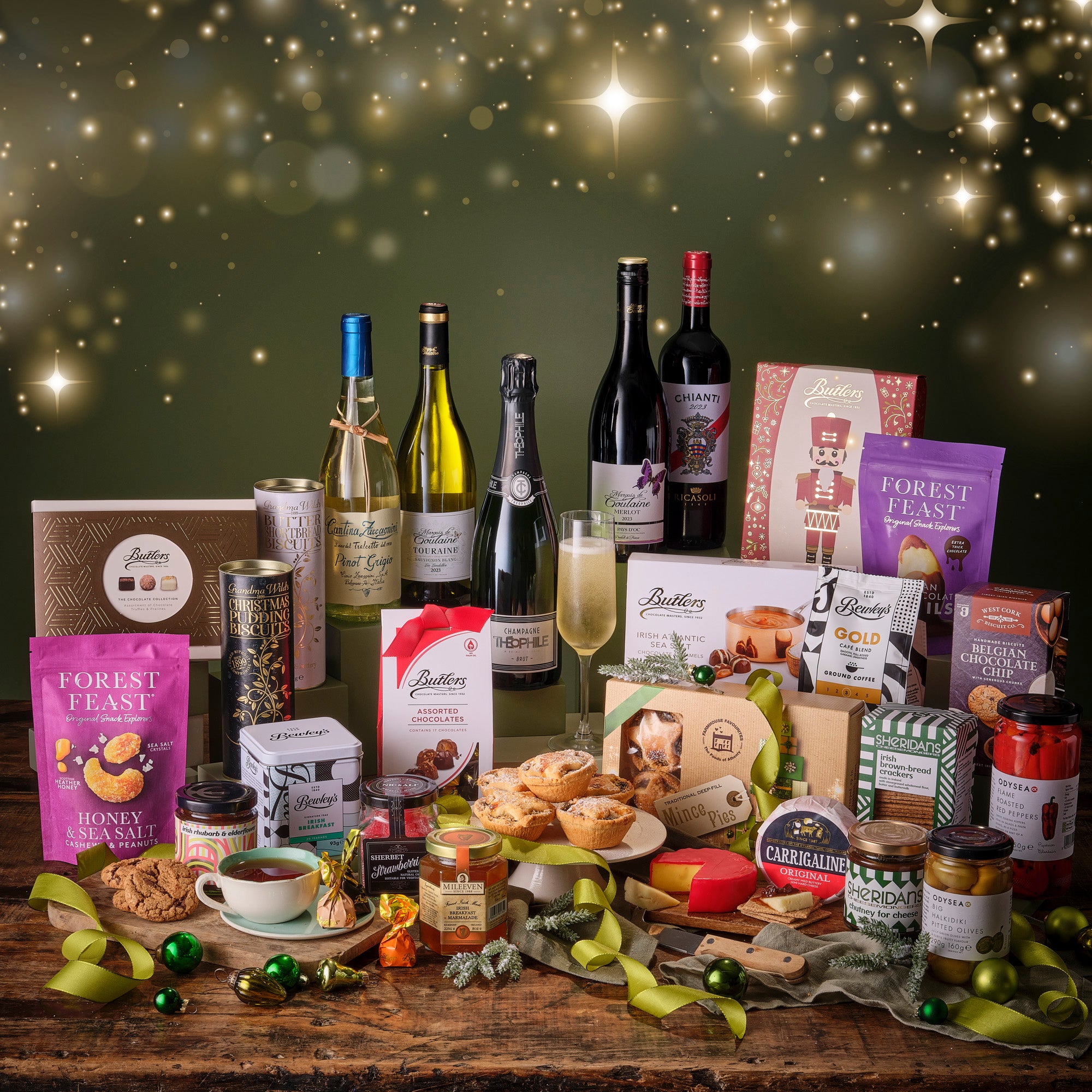 Assorted Irish food, red & white wine products on a wooden table with a festive background