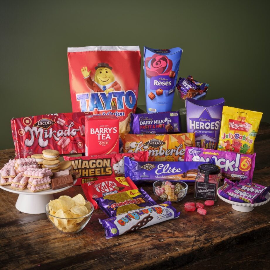 The Really Big Ireland Hamper featuring a large red Tayto bag and a spread of chocolates and snacks