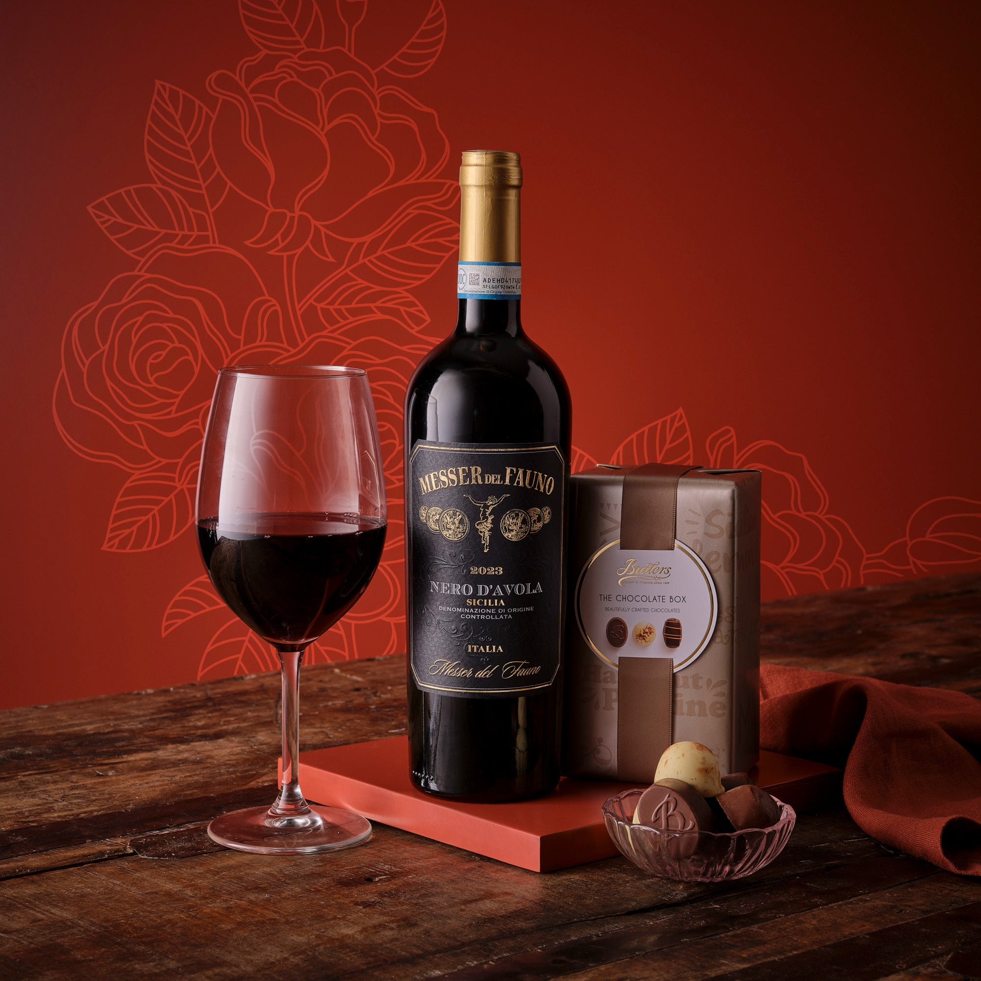 Red Wine and Chocolate for Mum Set including Nero d Avola bottle, chocolate box, wine glass, cheese and grapes.